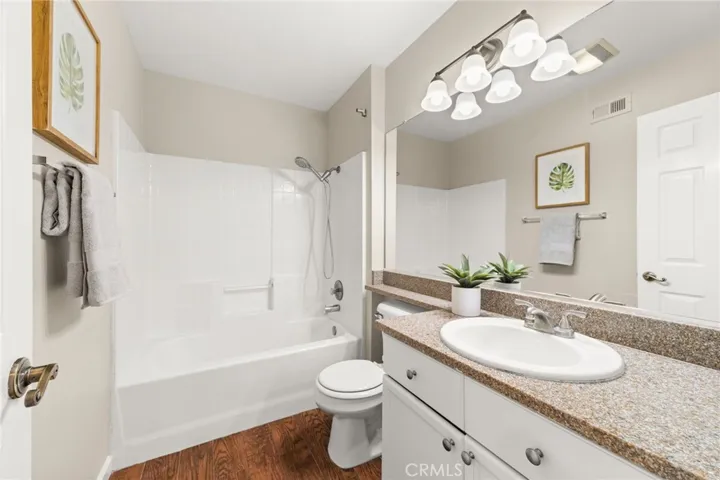 Full hall bathroom with tub and shower