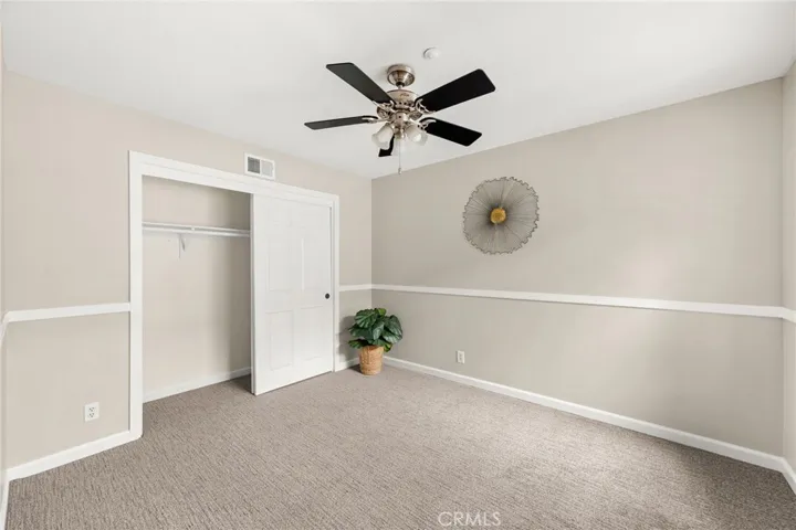 3rd bedroom with view of front courtyard