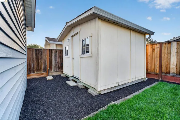 Standalone structure featuring a single window and door
