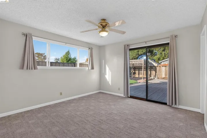 Room featuring neutral carpeting and light-toned walls