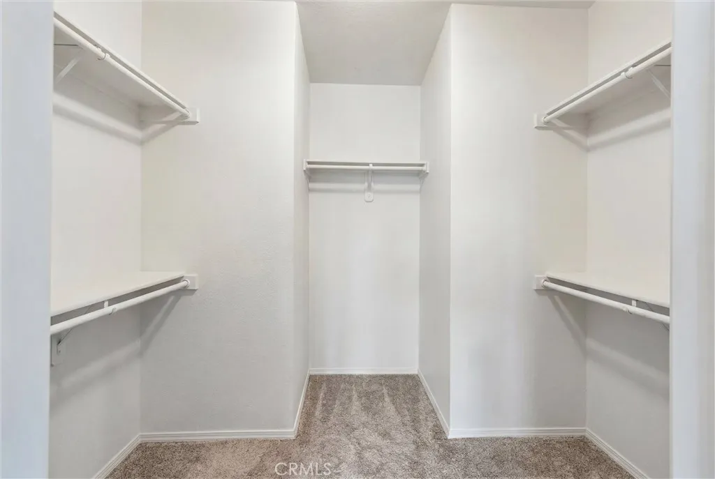 Primary Walk in closet. Clothing has been virtually removed