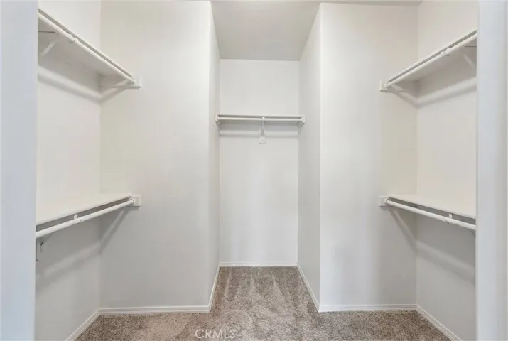 Primary Walk in closet. Clothing has been virtually removed