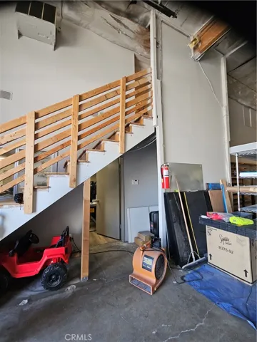 Stairs to mezzanine storage rooms.