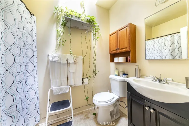 13175 Paramount Blvd residence interior photo of the full bath with tub/shower combo.