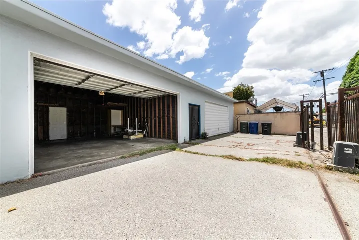 There are two - two car garages, one for each unit at the rear of the property off an access alley. With separate wrought iron sliding gates that is remote controlled for each unit.