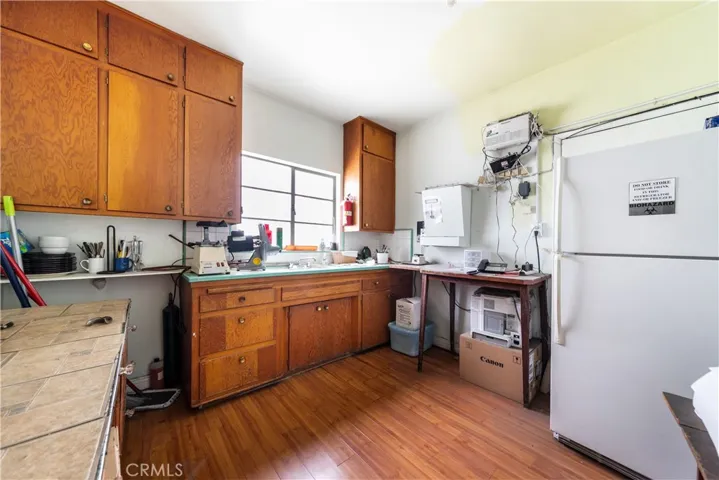 13175 Paramount Blvd interior photo of the work room and kitchen.