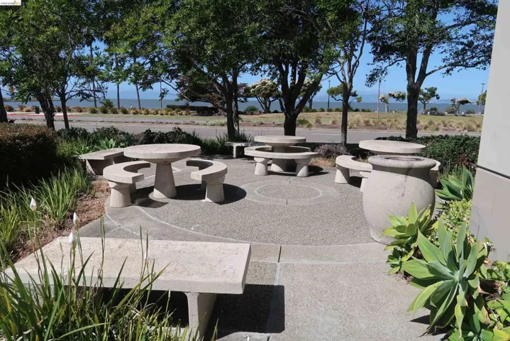 Table & seats adjacent to front of building.