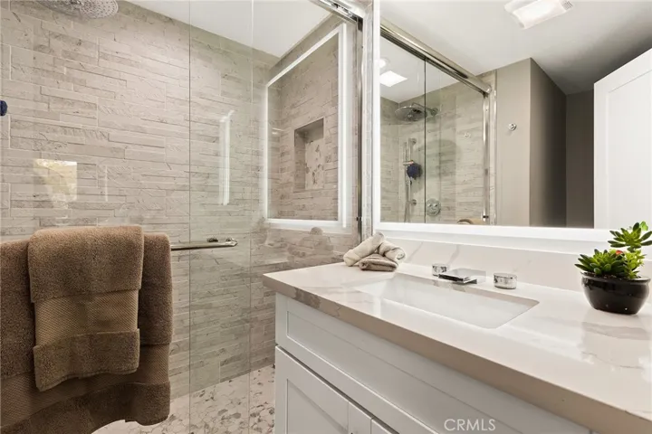 Primary en suit bath. Beautiful tile, New vanity and LED Lighted mirror