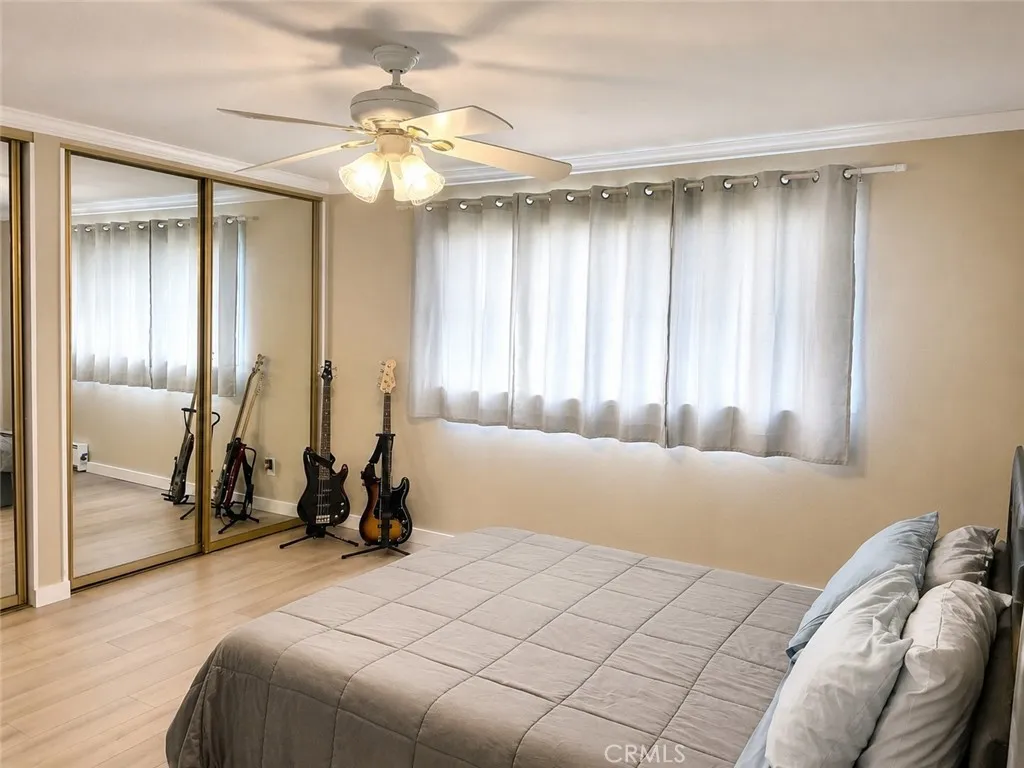 Bedroom with mirrored closet doors