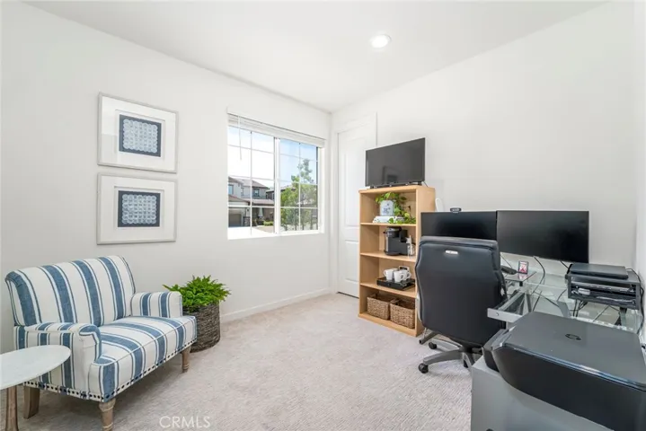 Front secondary bedroom with walk-in closet