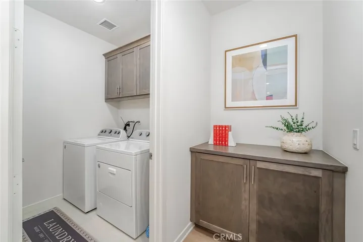 Interior laundry room with ample storage