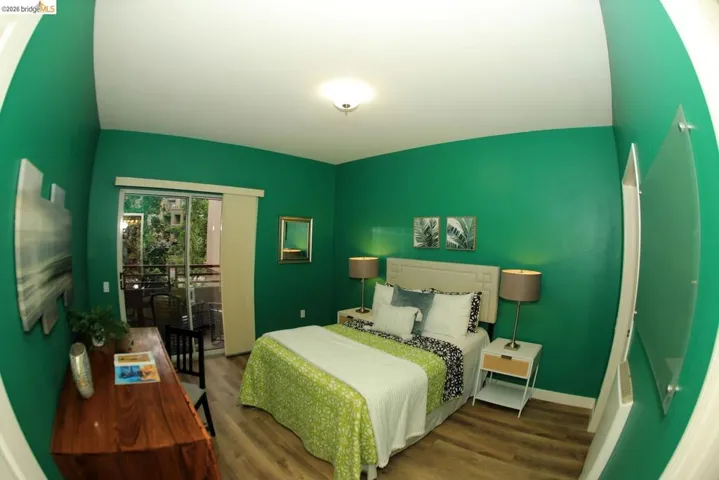 Interior room with wood-finish flooring and a white ceiling