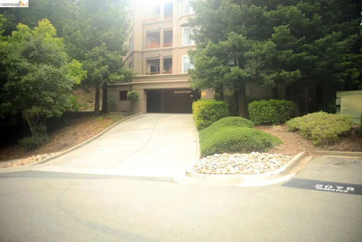 Multi-story building featuring an integrated parking garage entrance