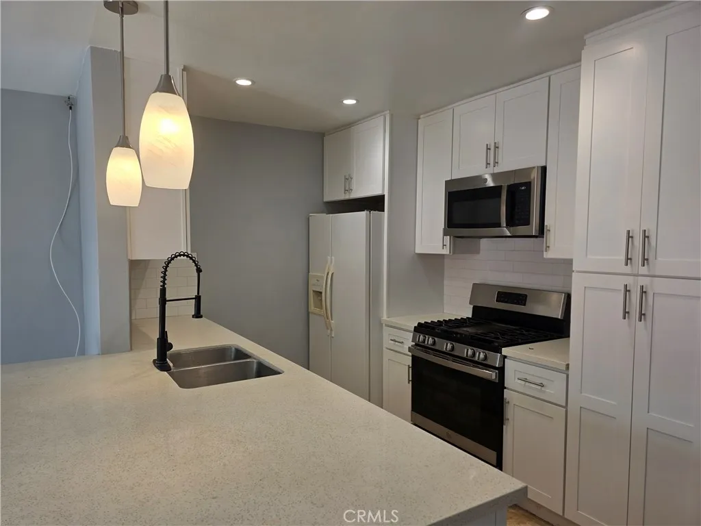 Upgraded white Shaker cabinets.