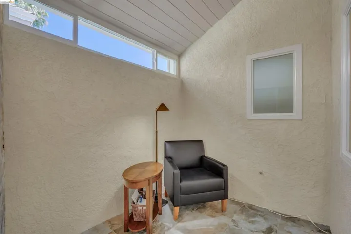 Vaulted ceiling with horizontal paneling and high transom windows