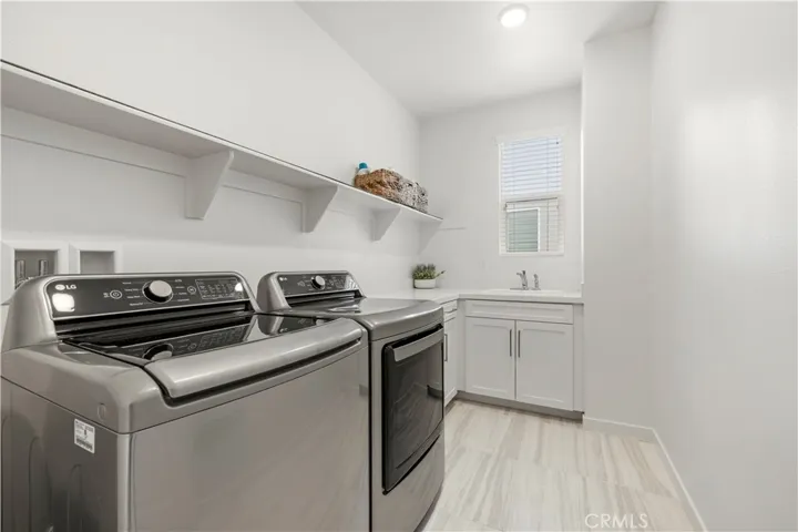 Upstairs Laundry room with sink