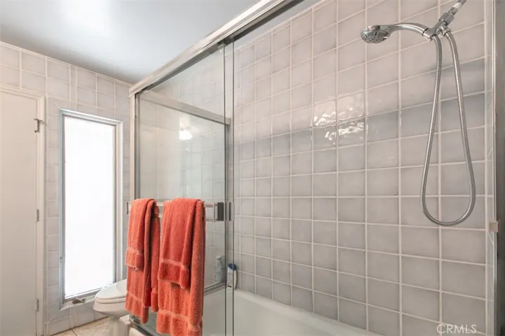 Bathroom has door out to pool