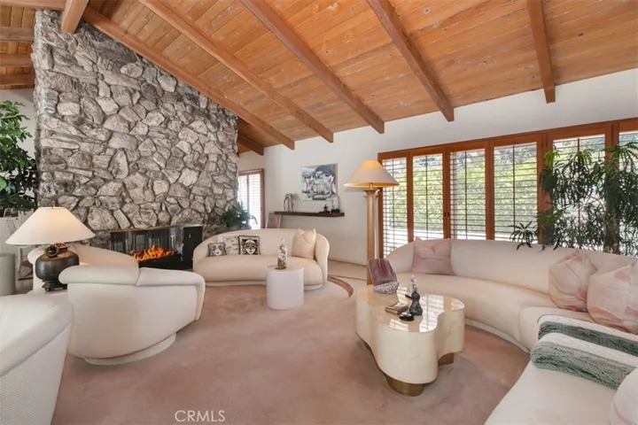 Living Room shares dual fireplace with Dining area