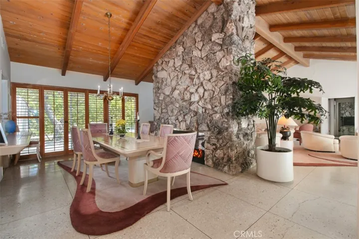 Formal dining area shares dual fireplace with Living Room