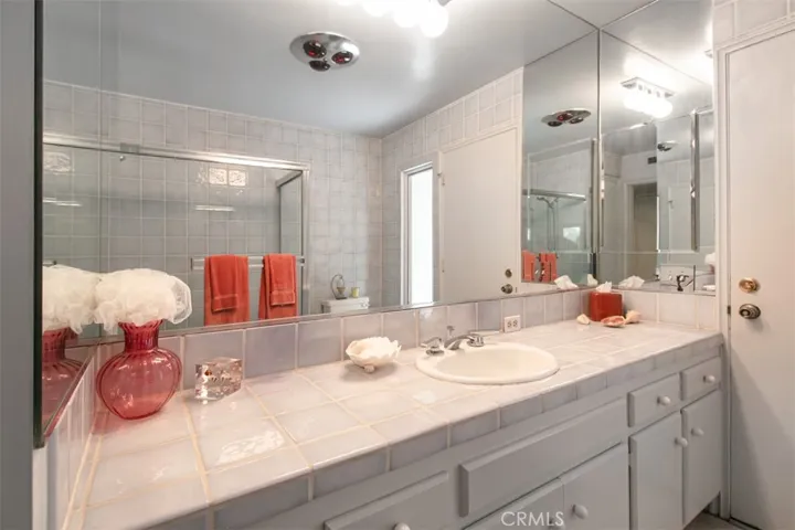 Bathroom of hallway and goes out to pool