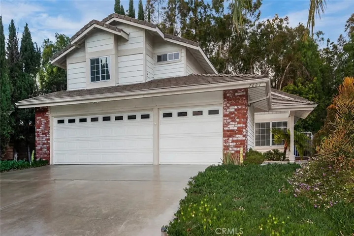 Quietly tucked at the end of a West Hills cul-de-sac, this nearly 2,000 sq. ft. home feels bright, welcoming, and instantly comfortable from the moment you walk through the door. The front yard is landscaped with colorful flowerbeds, mature succulents, cactus, a rose hedge, and a covered front porch perfect for morning coffee or relaxing evenings.