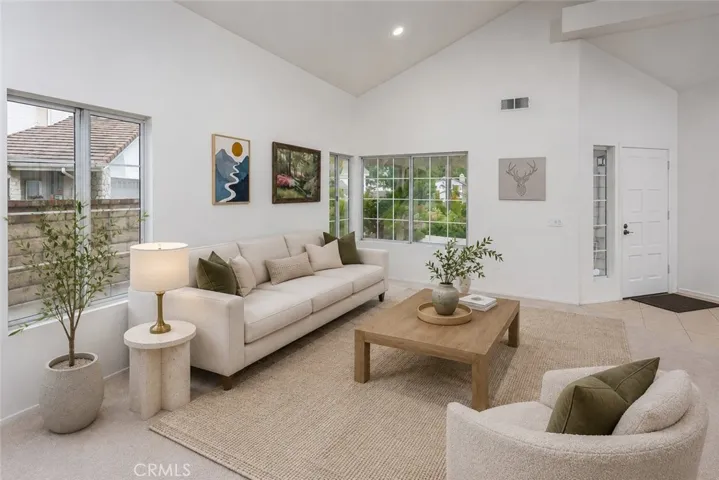 Virtually Staged
The living room features full color spectrum smart recessed lighting, while new carpet throughout, dual pane windows, central air and heat, and a Nest® thermostat add comfort and efficiency.