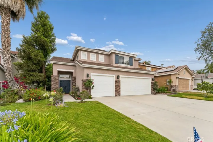 Front exterior view of the home, showcasing the curb appeal, landscaping, and entryway.