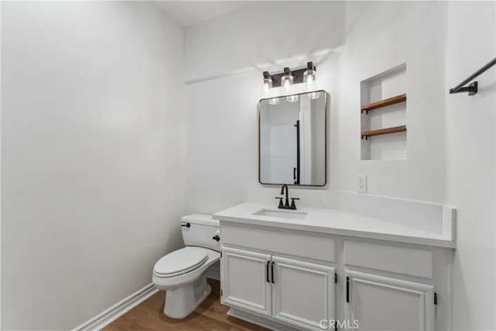 Downstairs bathroom featuring a full shower.