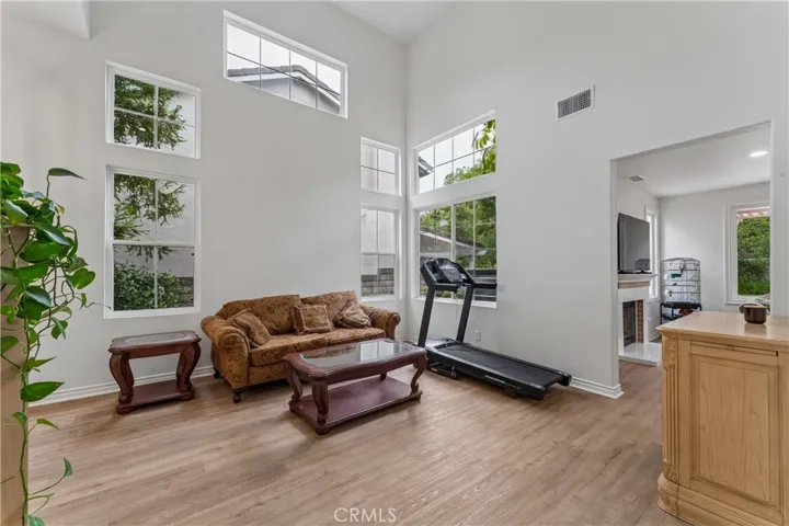 Spacious living room featuring impressive high ceilings, abundant natural light, and a modern open-concept layout.
