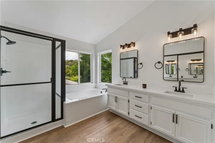 Stunning, renovated primary bathroom featuring modern finishes and premium fixtures.
