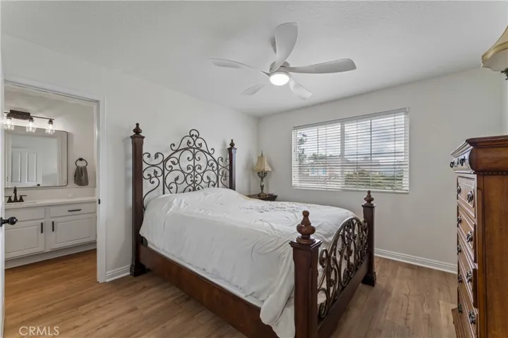 Large upstairs bedroom featuring ample natural light and spacious layout.
