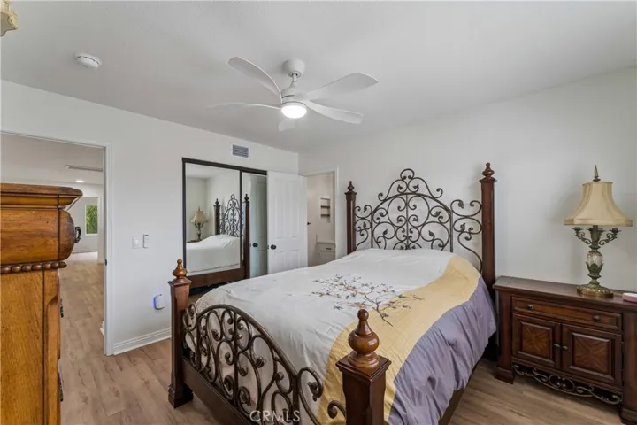 Large upstairs bedroom featuring ample natural light and spacious layout.