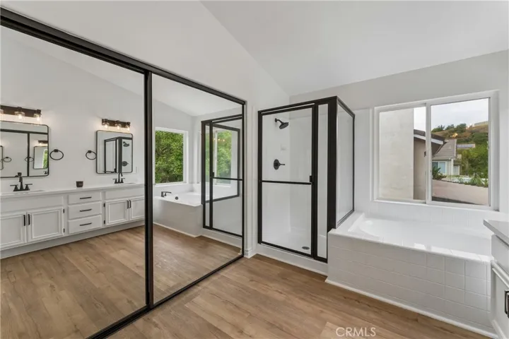 Stunning, renovated primary bathroom featuring modern finishes and premium fixtures.