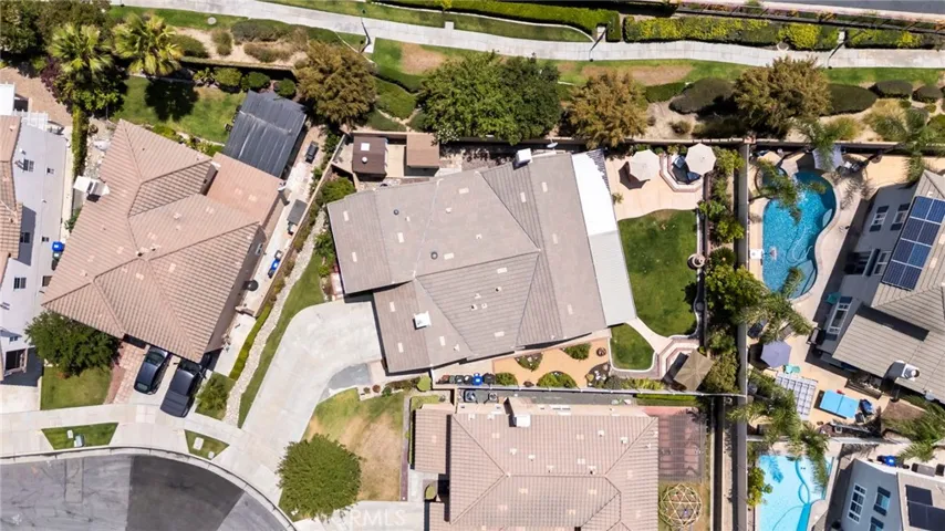 Lot is tucked back at the curve of the street giving a long driveway and larger backyard than most homes in the neighborhood. This