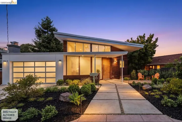 Modern architectural design featuring a prominent angular roofline, a full-view garage door with frosted panels, and a sleek wood-paneled entry door