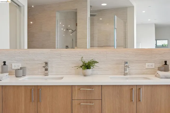 Dual vanity with white undermount sinks and chrome faucets