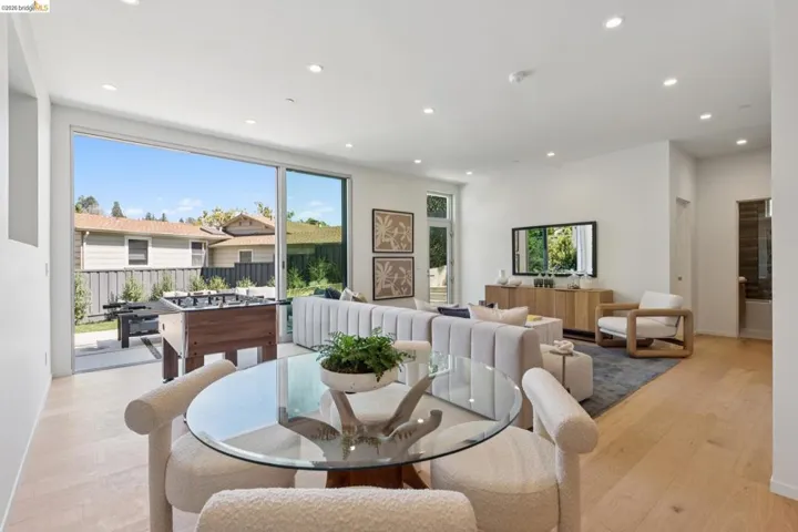 Open concept interior featuring wide plank wood-finish flooring and recessed lighting