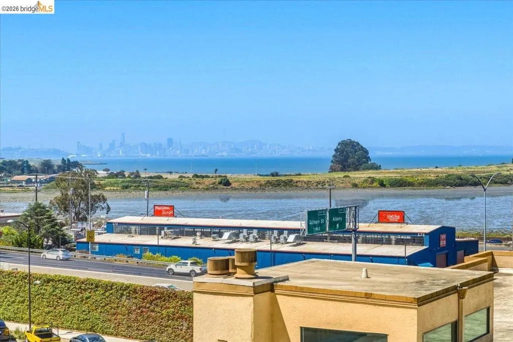 Expansive water scenery with distant city skyline Expansive water scenery with distant city skyline