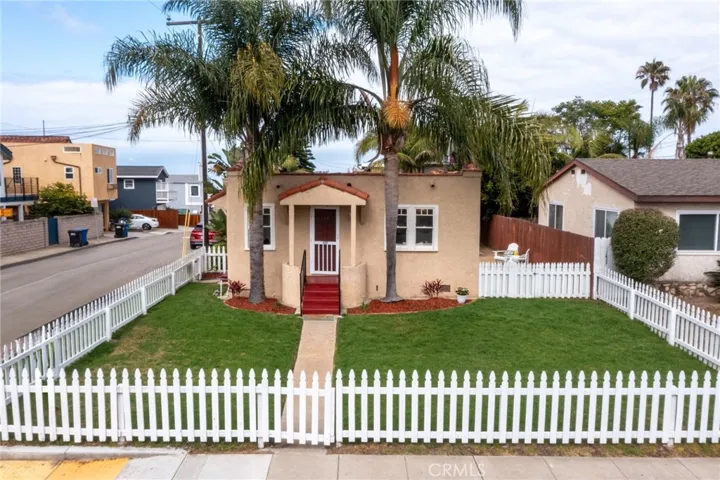 Great white picket fenced in front yard