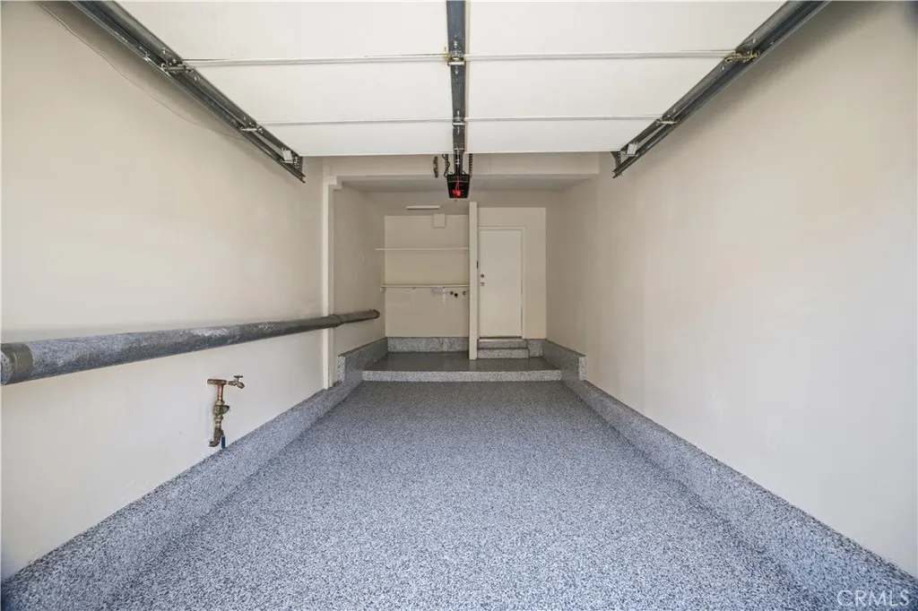 Attached 1-car garage with new epoxy floor and a fresh coat of paint.