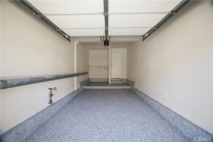 Attached 1-car garage with new epoxy floor and a fresh coat of paint.