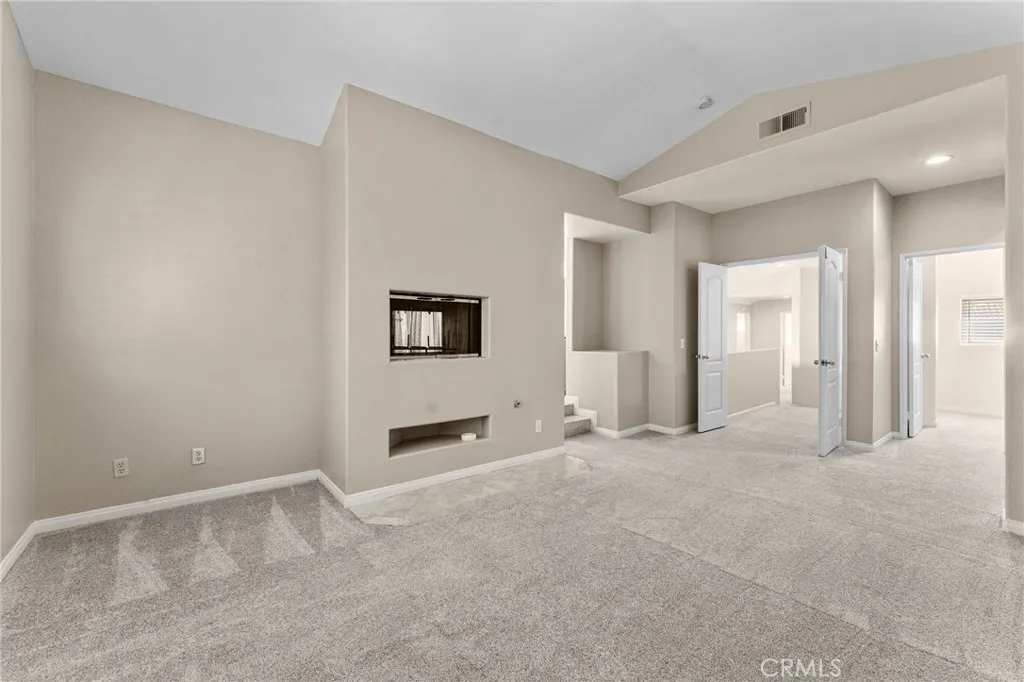 Spacious master bathroom includes a fireplace.