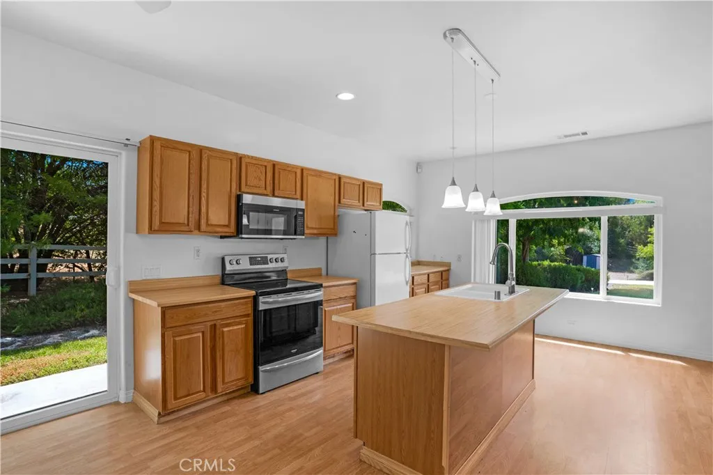 Casita kitchen and dining area with view of front and side yards