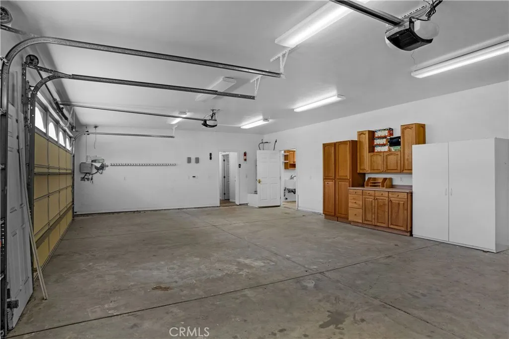 Garage with entry to house and workshop