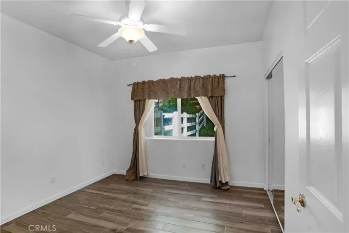 Bedroom with view of backyard
