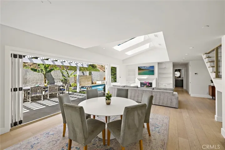 Bi-fold doors connect the space to the backyard, creating a seamless indoor/outdoor flow