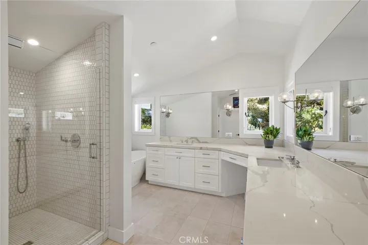 The spa-inspired primary bath includes a freestanding soaking tub and a separate walk-in shower.