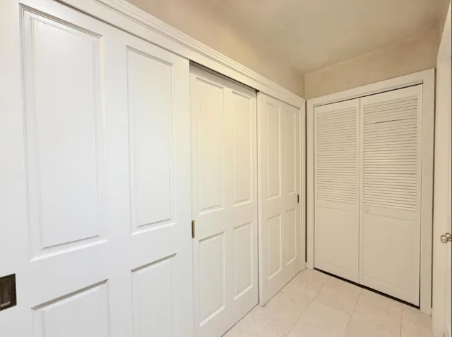 Primary bathroom with adjacent closet area.