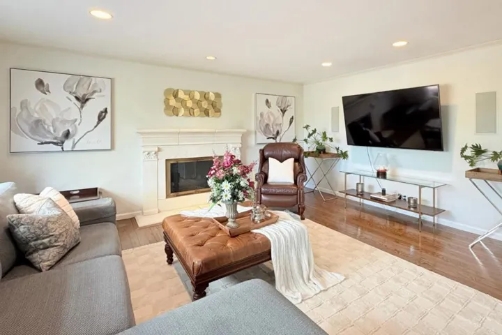 Family room with fireplace and recessed lighting.