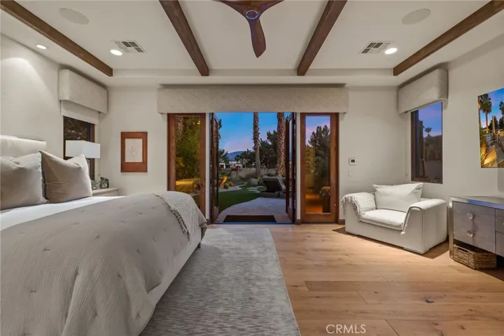 Primary suite French doors open to backyard